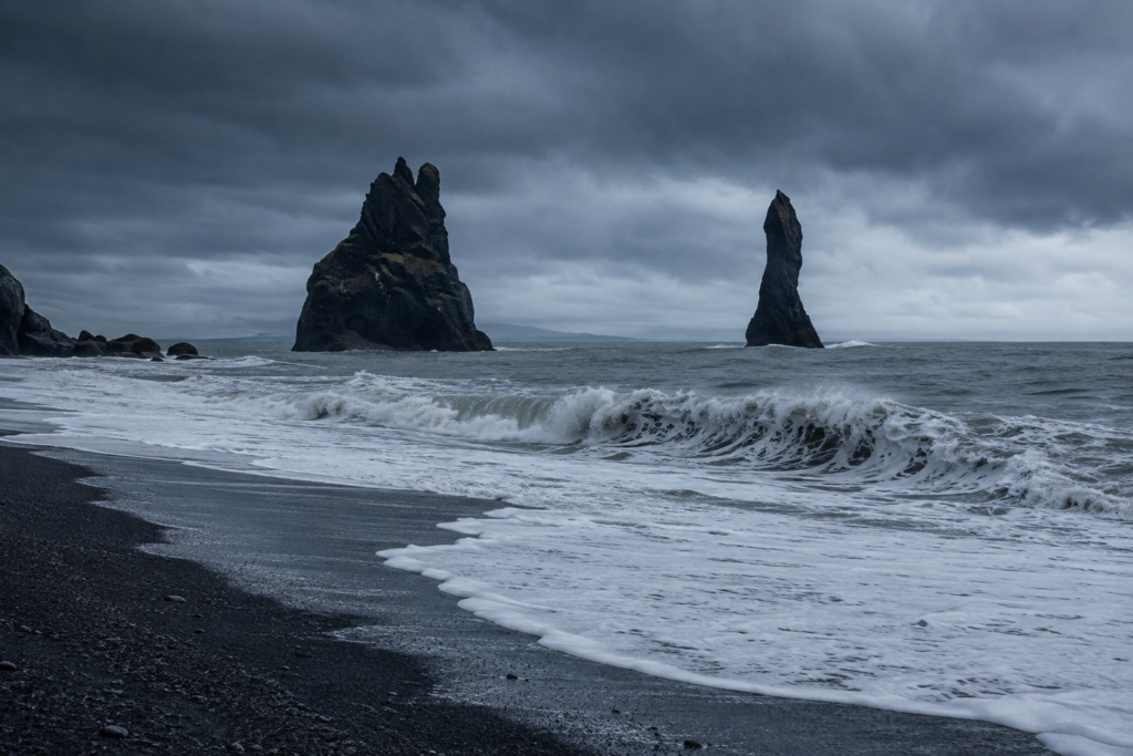 Black sand beach at Reynisfjara with basalt sea stacks on Iceland's South Coast